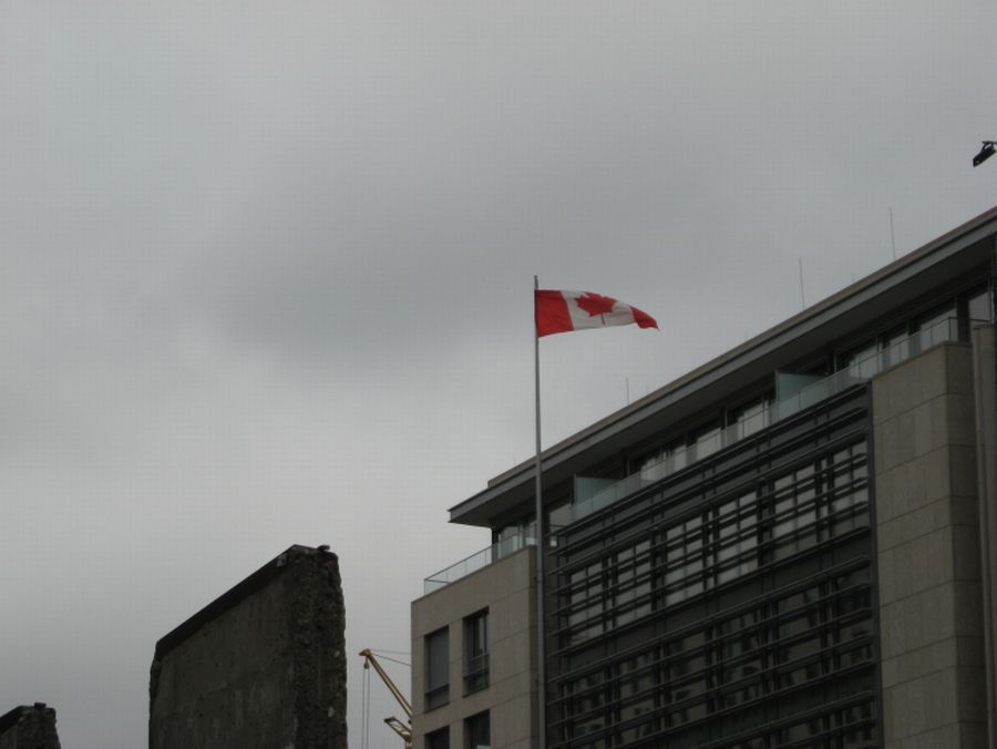 flag of Canada above roofs of Berlin